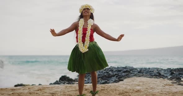 Woman performing Hawaiian hula on the beach