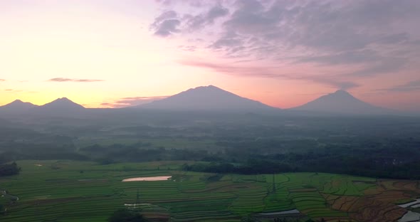 rural sunrise view with four volcanoes (Merapi, Merbabu, Andong and Telomoyo). sunrise and mountain