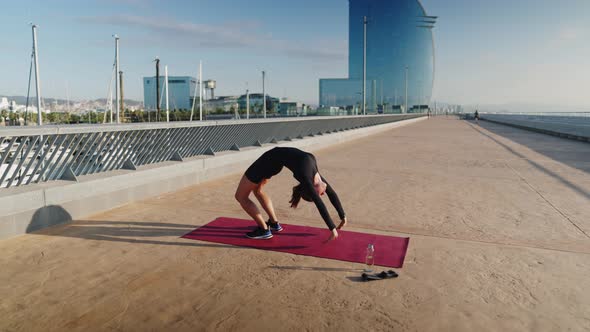 Female Doing Urdhva Dhanurasana Pose