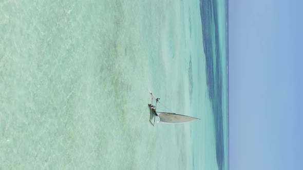 Vertical Video Boats in the Ocean Near the Coast of Zanzibar Tanzania Aerial View