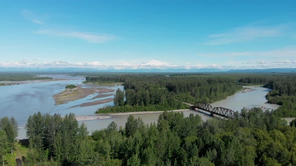 4K Drone Video of Alaska Railroad Train Trestle with Mt. Denali in Distance during Summer