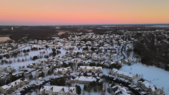 Aerial View Snow Covered Rooftops of Cottages Townhouse Settlement in Winter