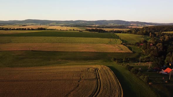 Rising over rolling hills near Martinkovice, Czech Republic. Aerial view.