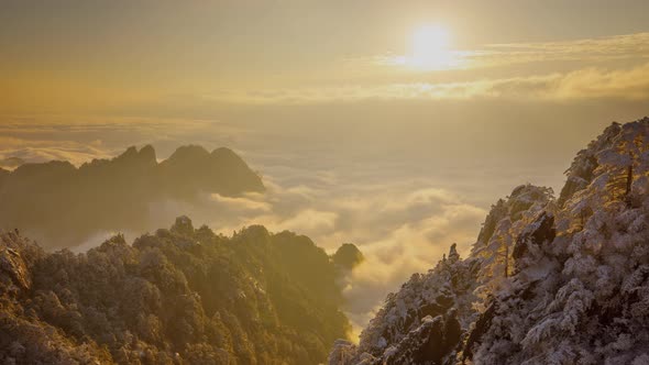 Sunrise time lapse looking out over a sea of fog at the Yellow Mountains (Huangshan) in China