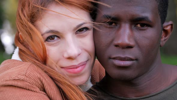 Portrait Of young attractive Happy Mixed Race Couple in the park