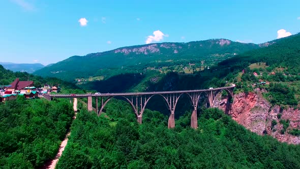 Drone Flight Above an Old Mountain Bridge Across The Canyon