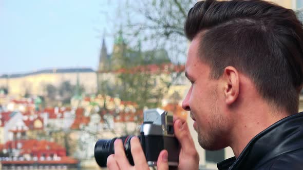 A Young Handsome Man Takes Photos of a Townscape - Face Closeup From the Side