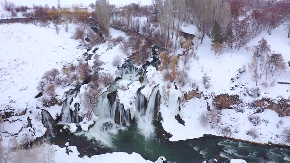 Fantastic view of powerful waterfall falling and hitting water surface inside the beautiful nature