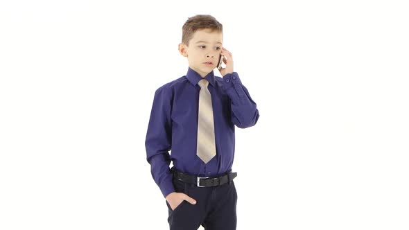 Little Businessman Makes an Important Call By Mobile at Work