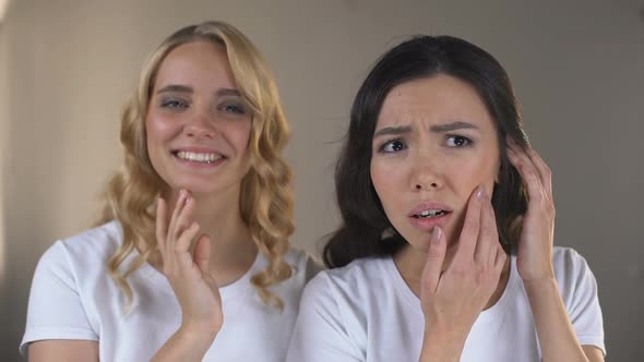 Woman Enjoying Reflection in Mirror, Her Friend Noticing First Wrinkles, Beauty