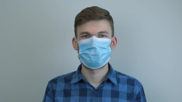 Portrait of caucasian man in medical face mask. Virus protection. Pandemic.