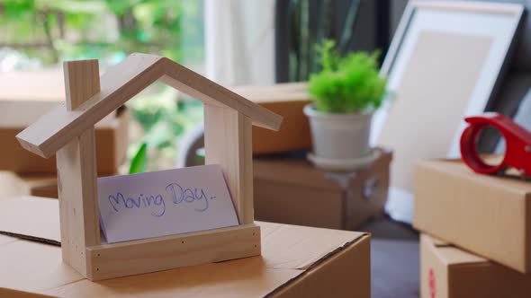 Stack of cardboard boxes in living room at new house on moving day