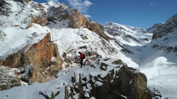 Climber Man In Winter Mountains