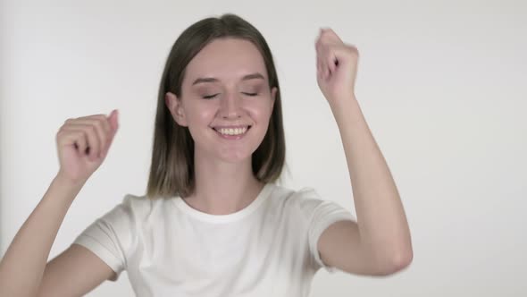 Happy Young Woman Dancing on White Background