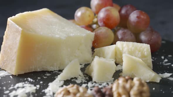 Cheese Plate Closeup with Several Varieties of Fruit and Cheese
