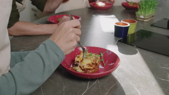 Eating Lasagna In Cooking Class