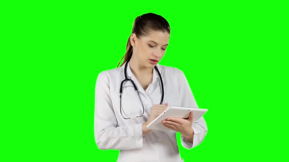 Female Doctor with Laptop. Green Screen