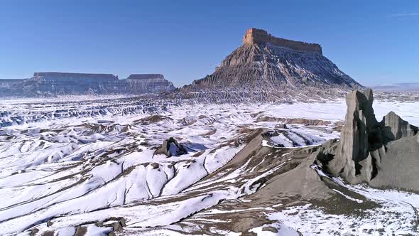 Aerial view of snow over desert landscape in Utah at Factory Butte