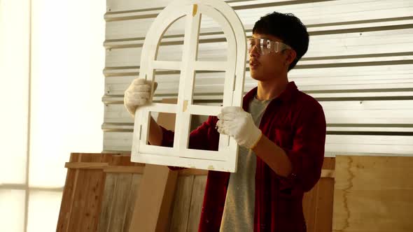 Woodwork and furniture making concept. Stylish craftsman working in his carpentry workshop