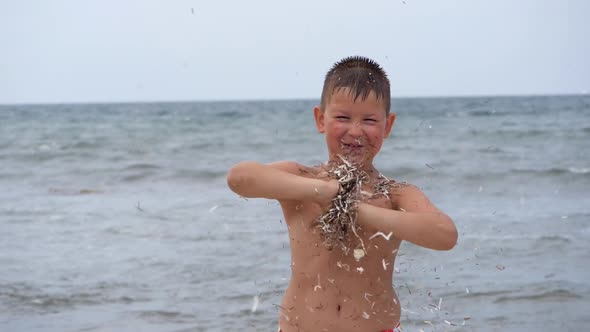 Beach Summer Vacation. Children's Emotions. The Child Develops Tinsel in the Wind.