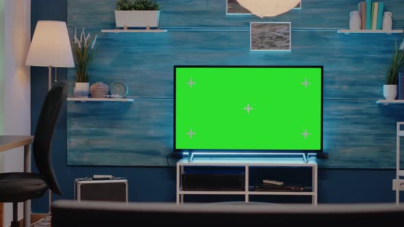 Empty Room with Green Screen on Television Monitor