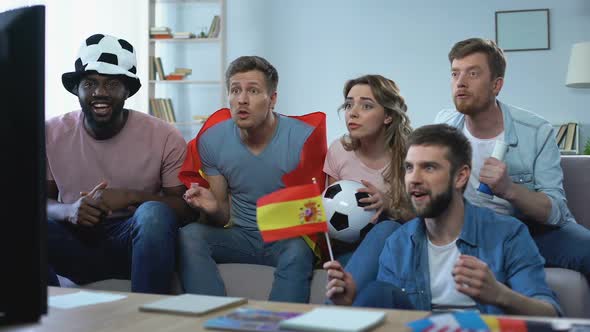 Spanish Friends Watching Match at Home, Supporting Team, Celebrating Goal