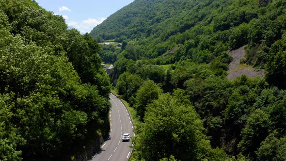 Aerial view of natural mountain valley with serpantine road. Pyrenees