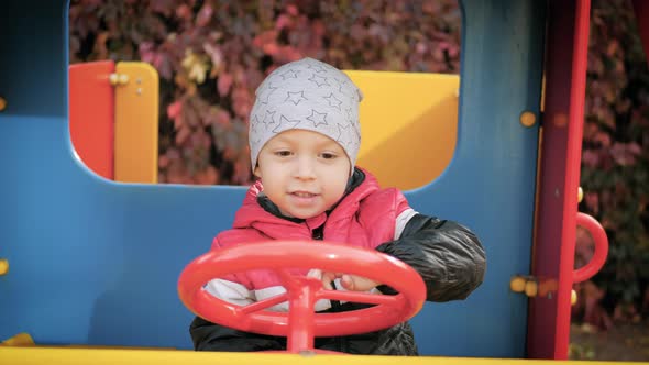 Little Boy Have Fun on the Playground.