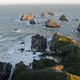 Setting Sun Illuminates Boulders and Waves of Nugget Point - VideoHive Item for Sale