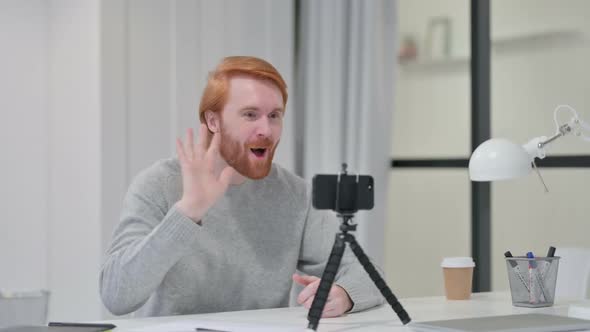 Video Recording on Smartphone By Young Beard Redhead Man