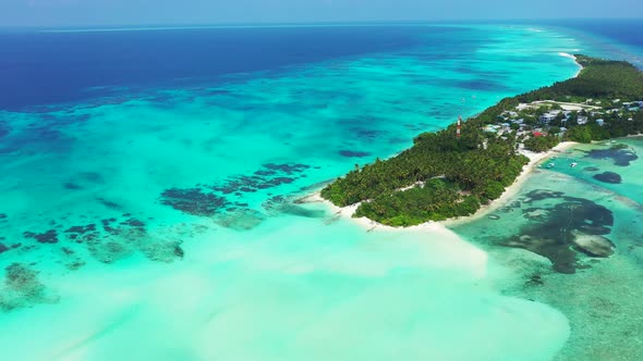 Wide drone abstract shot of a white sand paradise beach and blue ocean background in 4K