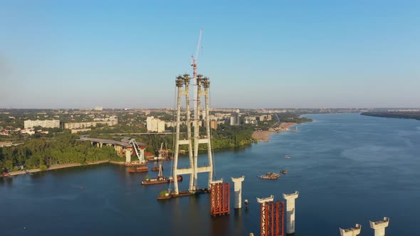 Incomplete Automobile Bridge on the Background of an Industrial City