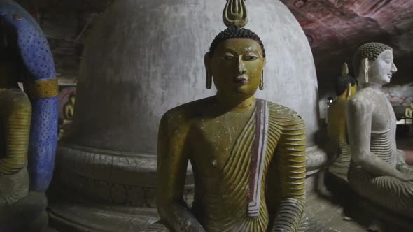 DAMBULLA, SRI LANKA - FEBRUARY 2014: Sitting Buddhas at the Golden Temple of Dambulla. The Golden Te