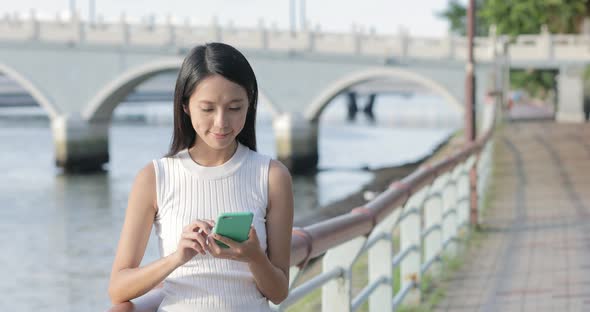 Woman use of mobile phone in Hong Kong city 