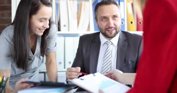 A Man Boss Listens to Women Closeup