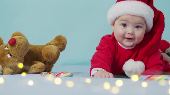 Merry Christmas and Happy New Year, Childhood, Holidays Concept Close-up. 3 Month Old Newborn Baby