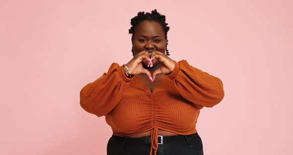 AfroAmerican Plump Lady Makes Love Gesture and Moves Hand