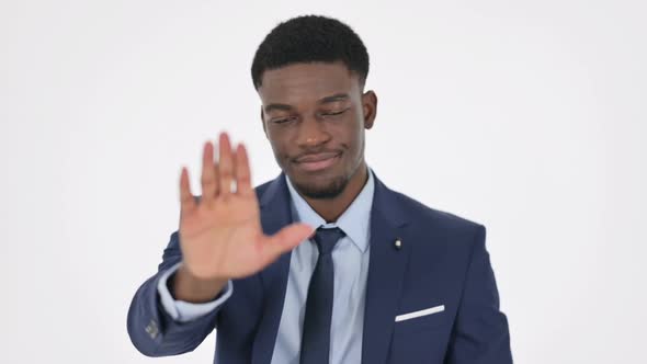 African Businessman Showing Stop Sign on White Background