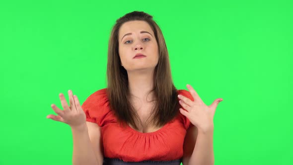 Portrait of Cute Girl Is Reporting a Lot of Interesting Information. Green Screen