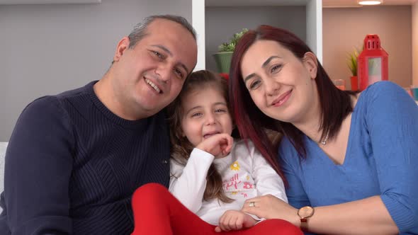 Happy family frame. Mom dad and little girl.