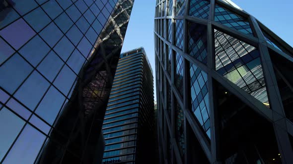 Business district building with wall mirror with blue sky