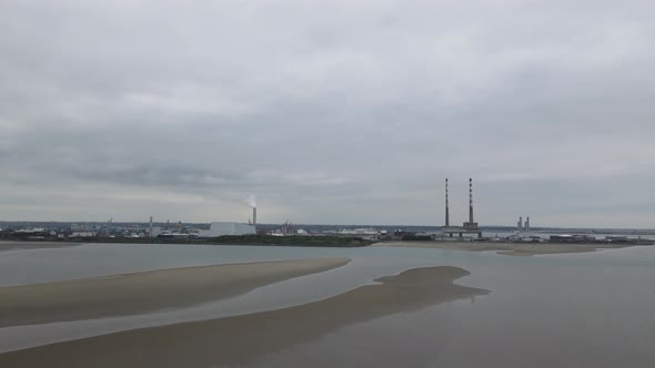 Poolbeg Power Plants And Dublin Bay From Sandymount Strand Beach In Dublin, Ireland. wide shot