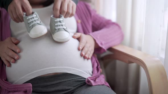 Pregnant Couple Feels Love and Relax at Home