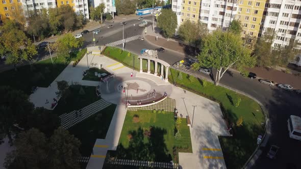 People Are Resting and Walking on Small Square in Russian City in Sunny Summer Day, Aerial View