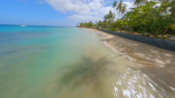 FPV drone flight along stunning tropical coastline of Playa Punta Popy
