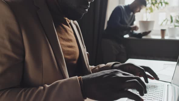 African American Businessman Working on Laptop in Office