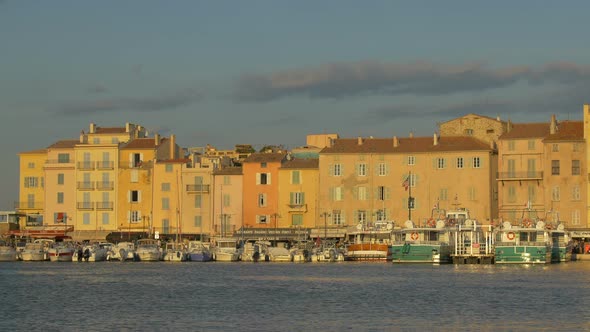 Pan right of houses in the port of Saint-Tropez