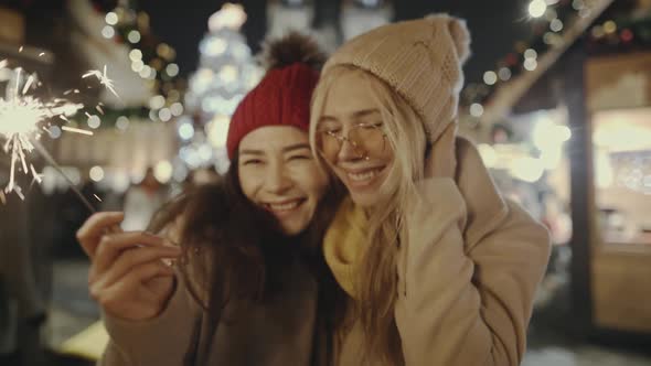 Beautiful Happy Asian Women Lesbian LGBT Couple Kissing and Hugging in the European Street of Old