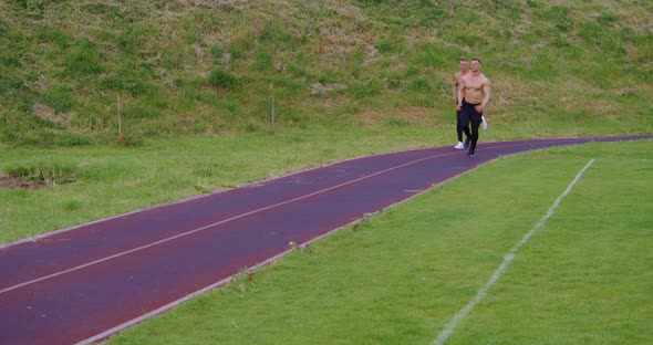 Athletic Men with Bare Torso Running Outdoors