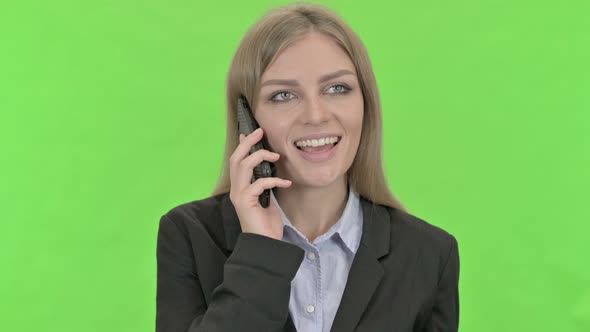 Young Businesswoman Talking on Smartphone Against Chroma Key